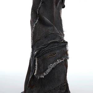 Side view showing the structured shoulder pads on the distressed jacket.