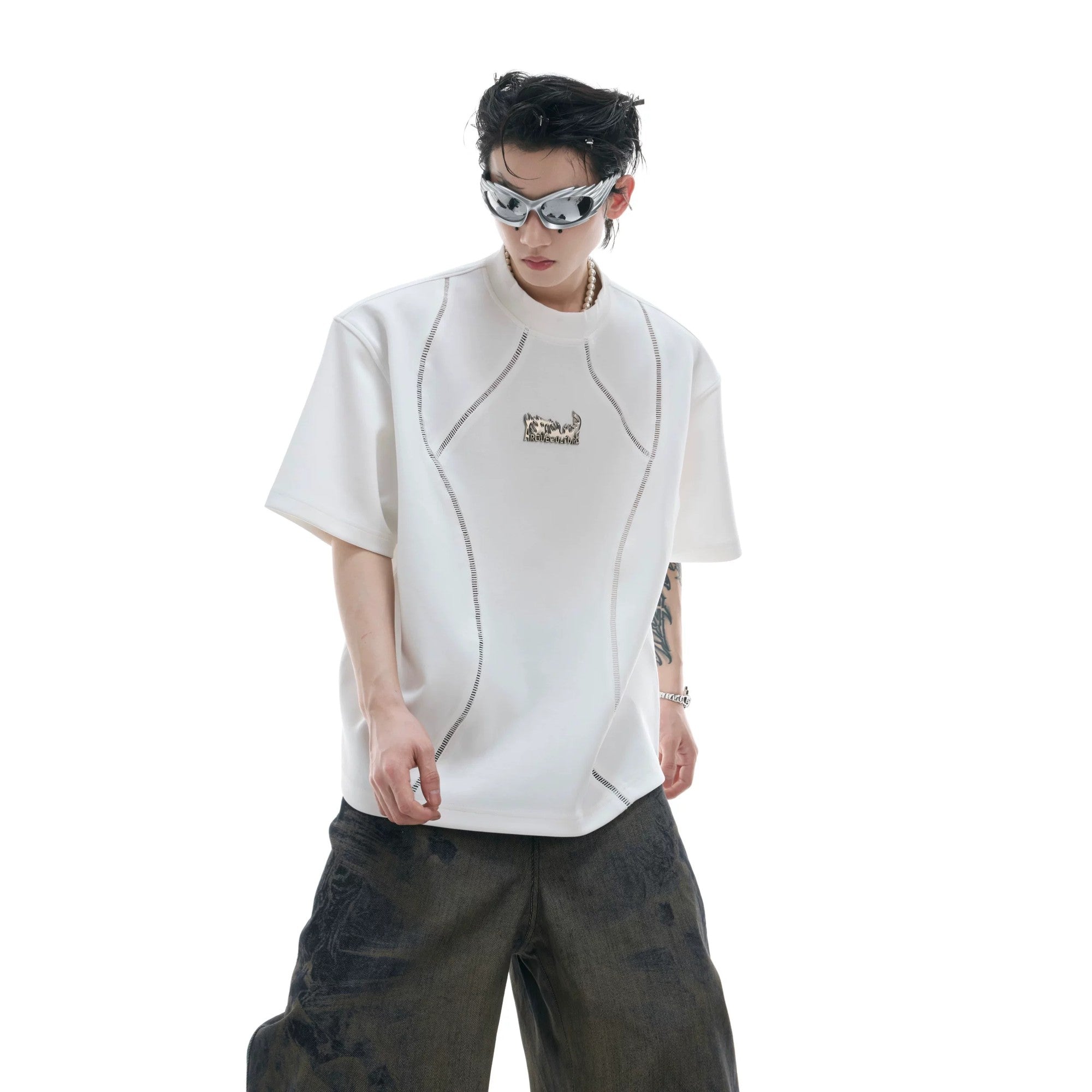 Back view of black deconstructed tee showing premium spliced fabric details