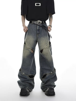 Front view of men's deconstructed hollow-out wide leg jeans in vintage wash