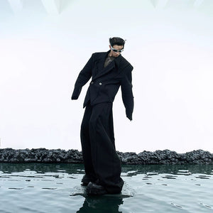 Model wearing white deconstructed blazer set in a casual street setting