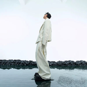 Wide-leg trousers with pleated details from the deconstructed set