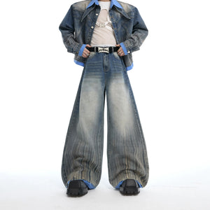 Male model wearing a full deconstructed denim jacket and pants set.