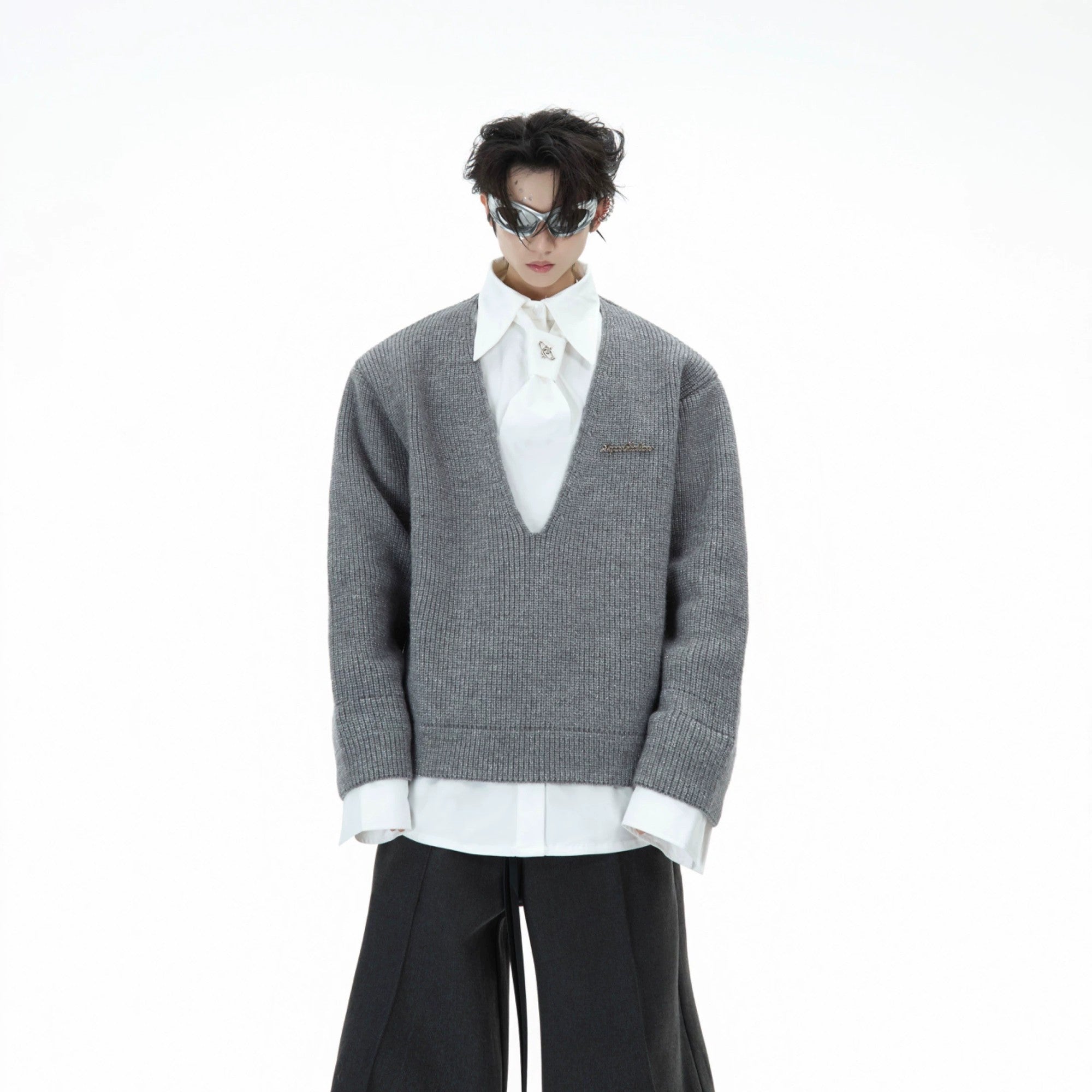 Black streetwear knitwear featuring a faux two-piece layered shirt design.