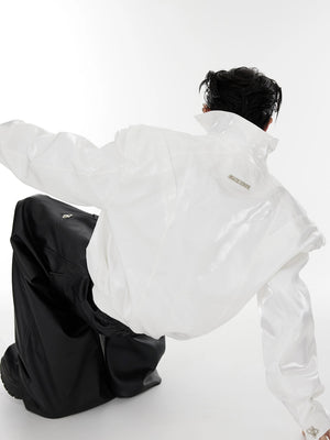 White liquid shimmer cropped jacket styled in a streetwear setting