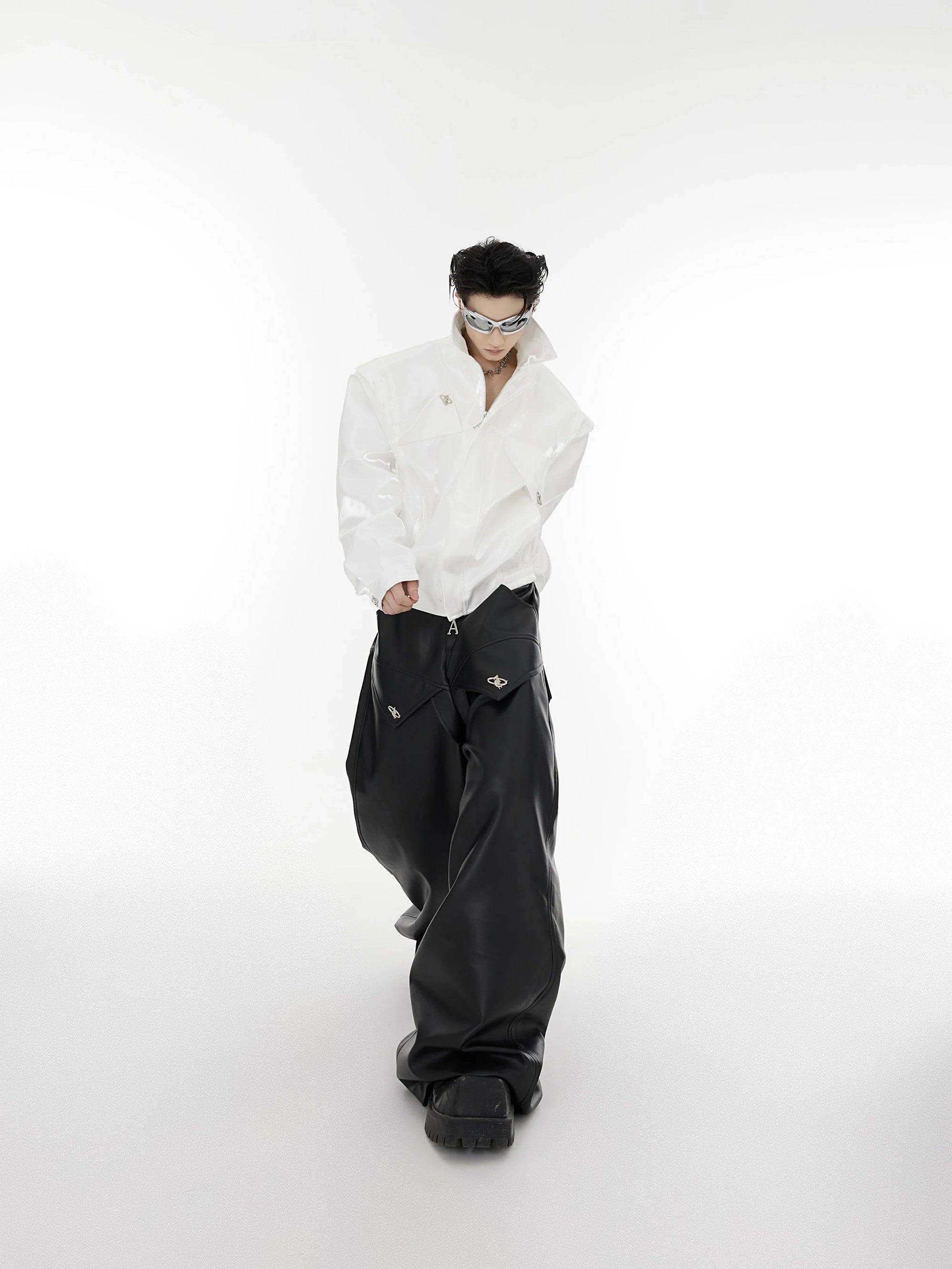 Model wearing deconstructed liquid metal jacket in urban environment