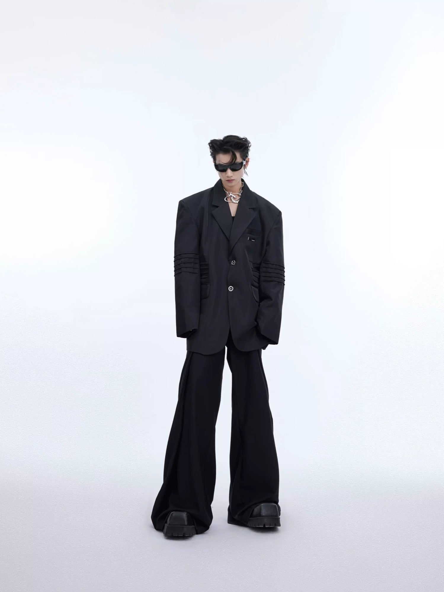 Side view of a structural padded shoulder blazer with liquid metal finish