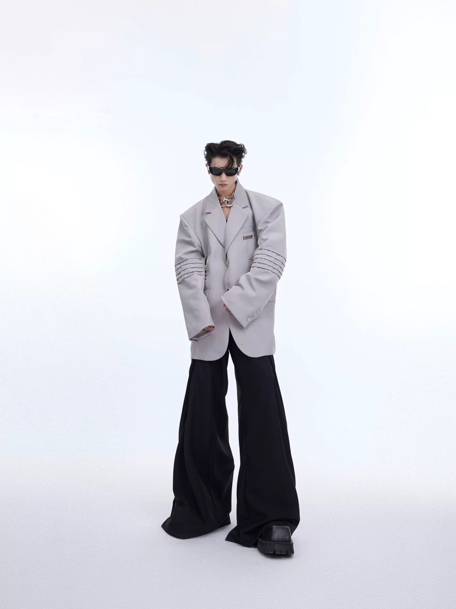 Street style outfit featuring a liquid shine deconstructed suit jacket
