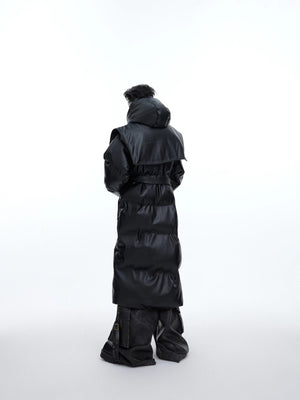 Back view of heavy deconstructed long puffer coat in black