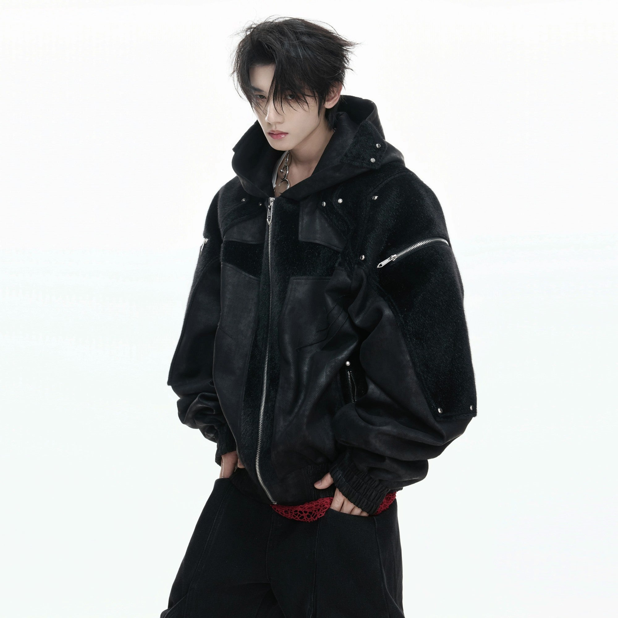 Close up of deconstructed armor shoulder design and faux fur texture