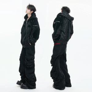 Model wearing black armor style moto jacket in urban street setting