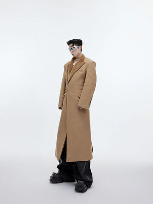Back view showing the loose silhouette and patchwork design of the coat.