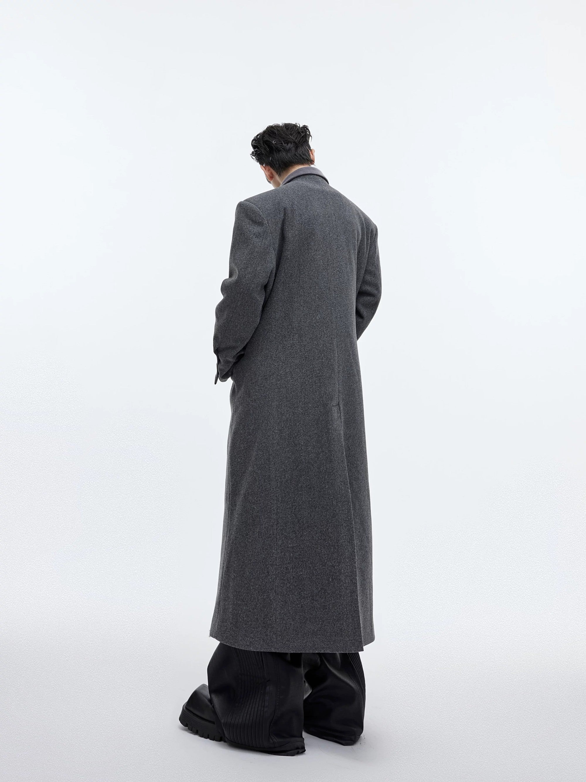 Detailed texture of the wool blend notched lapel and plush edging.