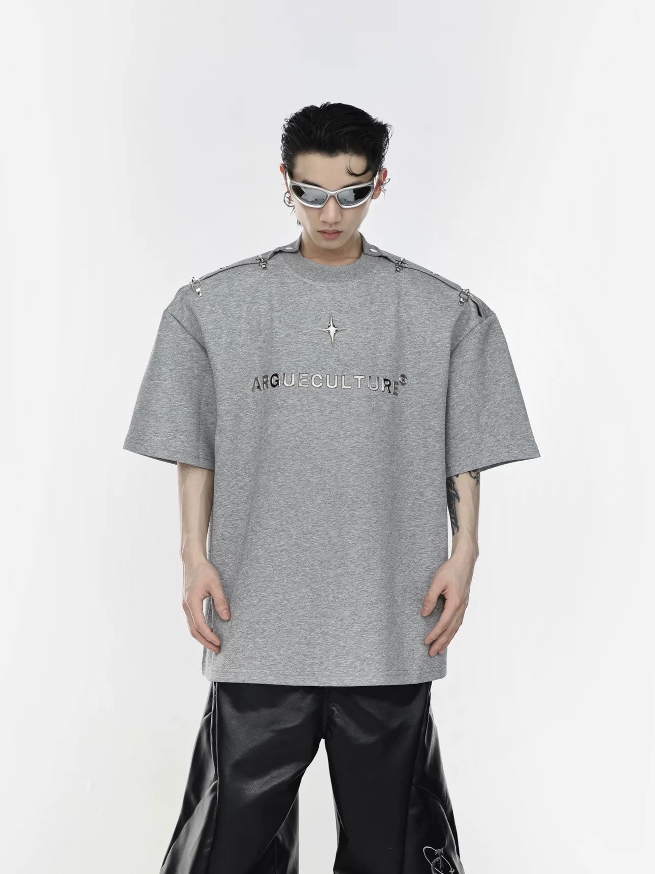 Model wearing deconstructed tee in off-the-shoulder style