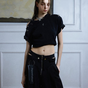 Close up of high-quality metal zipper and deconstructed waist design