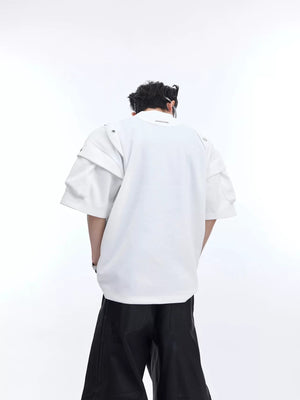 Model wearing white boxy tee showing structured shoulder silhouette