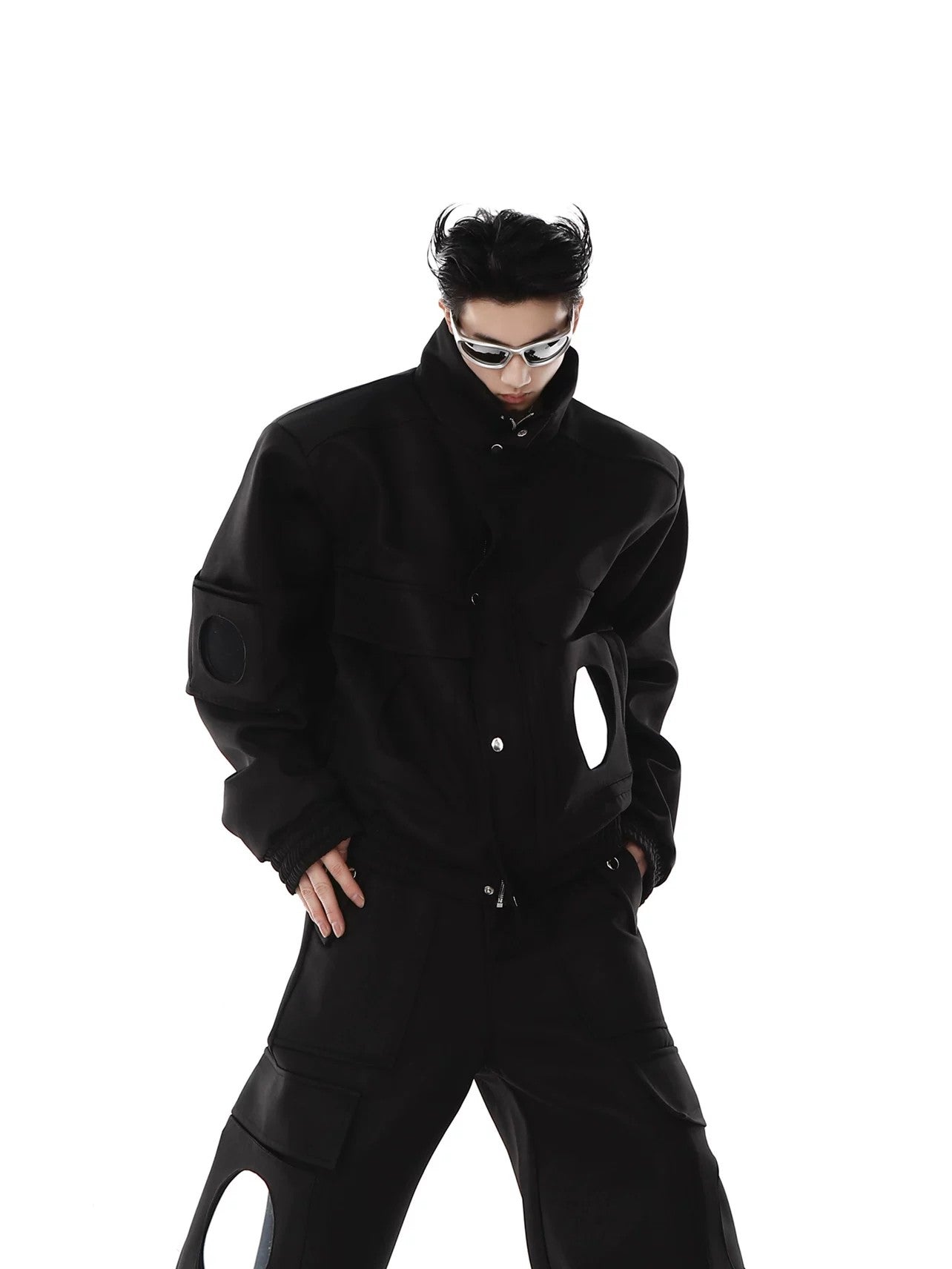 Model wearing the mirror patchwork jacket in an urban streetwear setting.