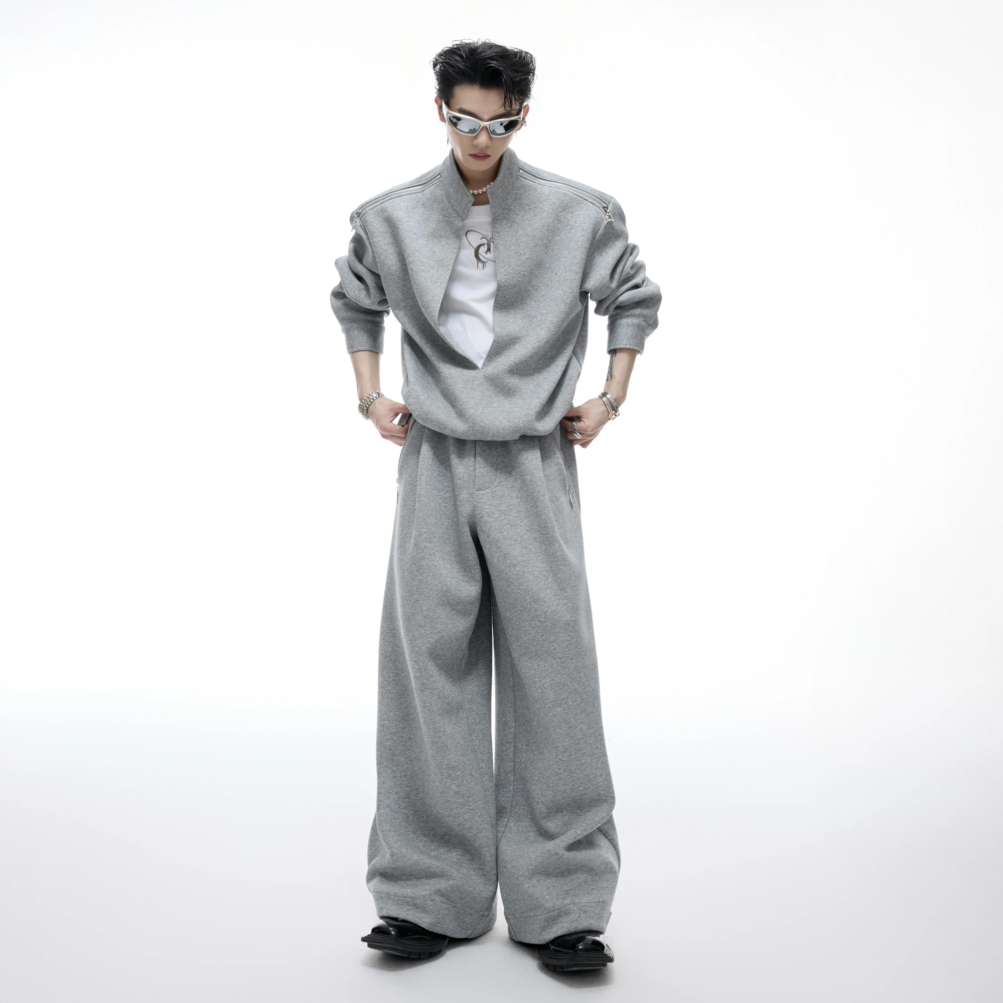 Close-up of gray wide-leg sweatpants with split hem design