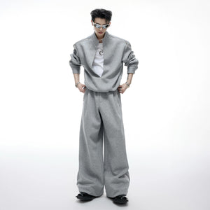 Close-up of gray wide-leg sweatpants with split hem design