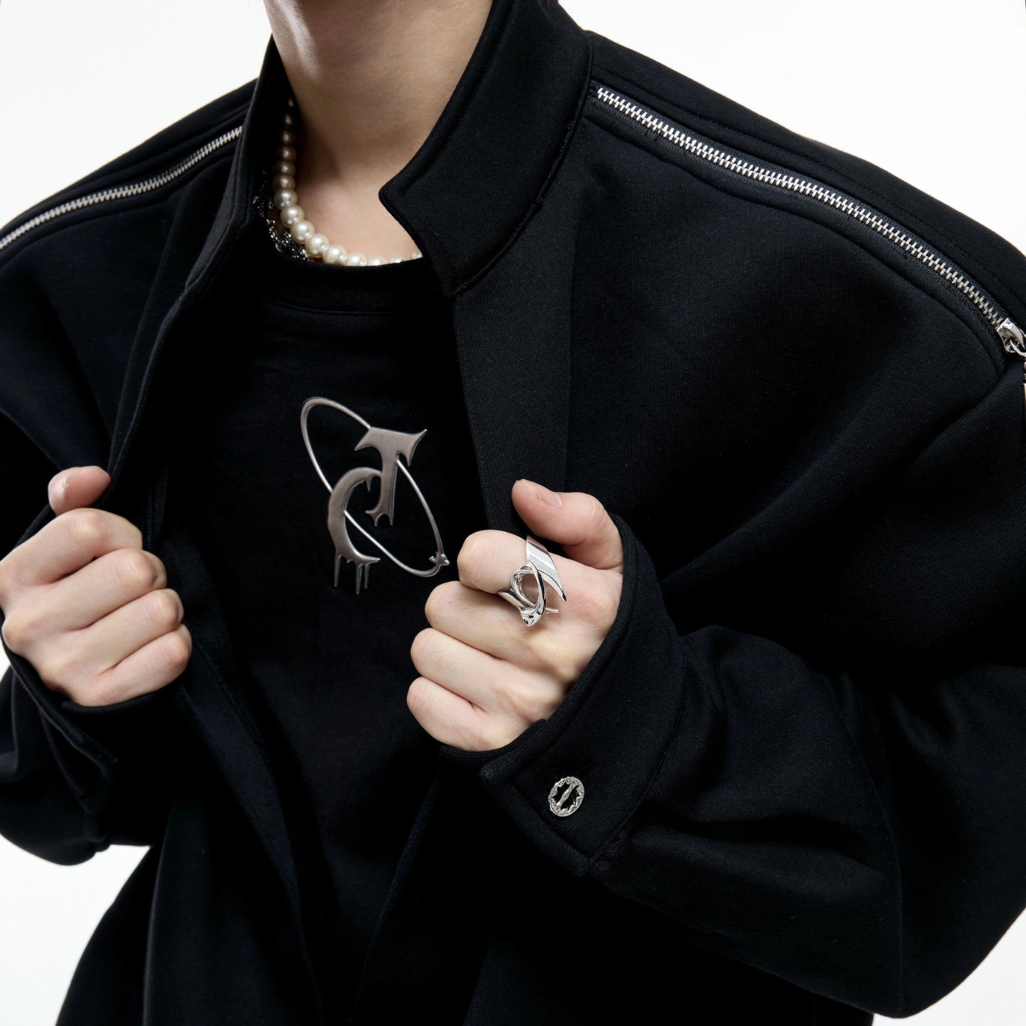 Detailed view of the fake two-piece mock neck and zipper design