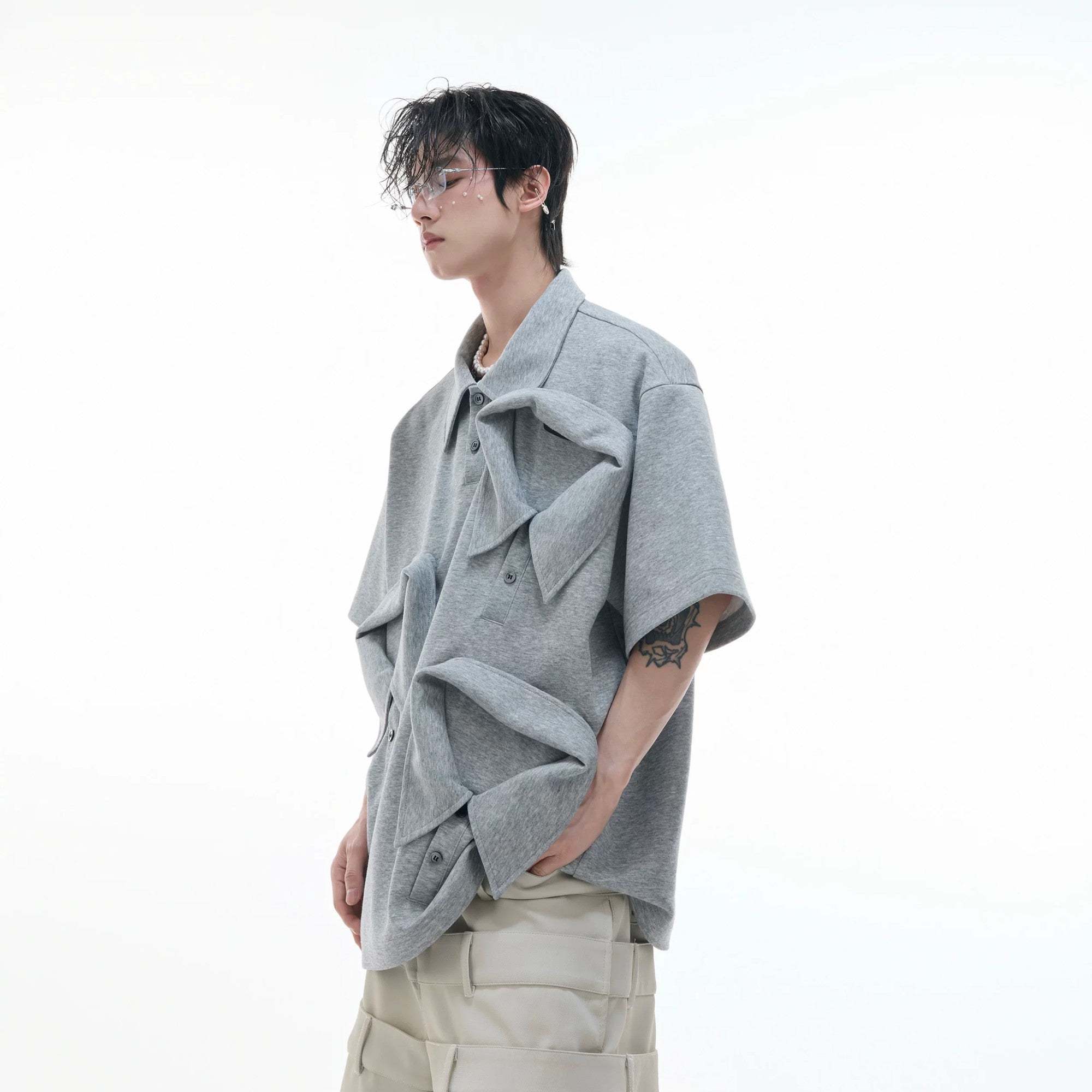 Close up of the layered collar design on gray streetwear polo