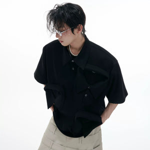 Male model wearing white deconstructed polo shirt in urban setting