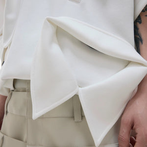 Back view of the geometric design deconstructed short sleeve polo