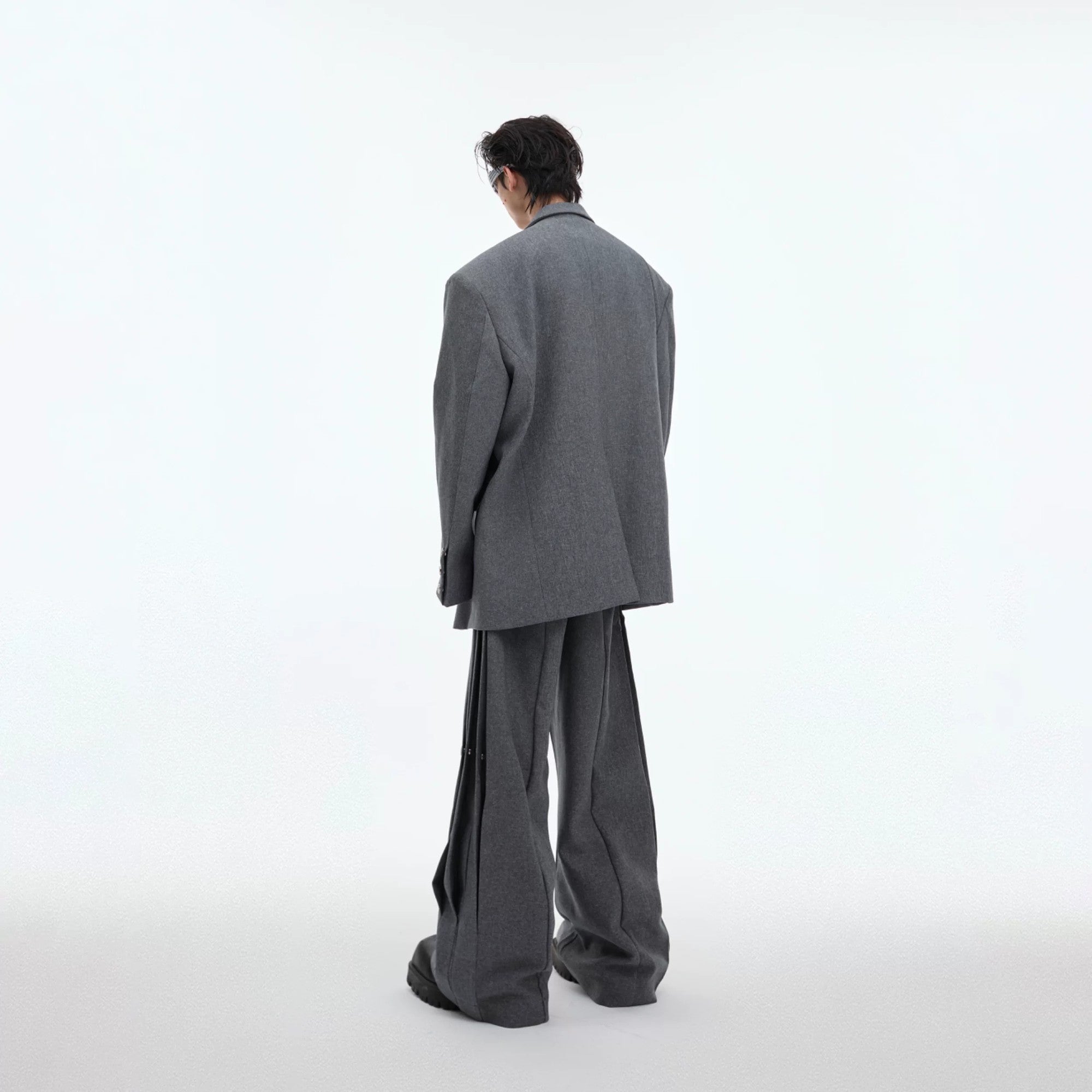 Close-up of the metal rivet details and padded shoulder construction.