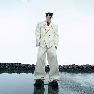 Street style model wearing white deconstructed oversized blazer