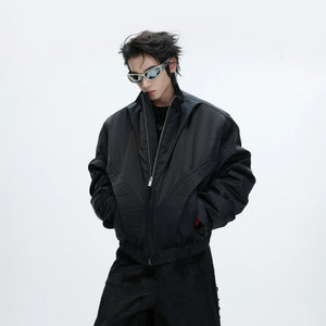 Lifestyle shot of a model wearing the loose fit deconstructed bomber