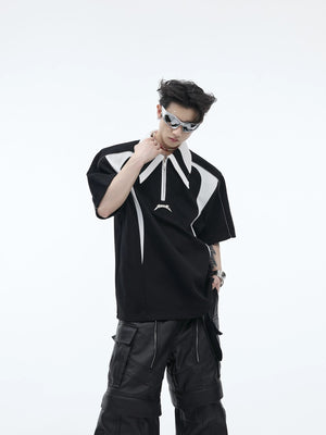 Front view of a white deconstructed polo shirt with shoulder pads and metal details.