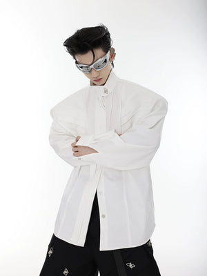 Side view of black loose silhouette shirt showing pleated details