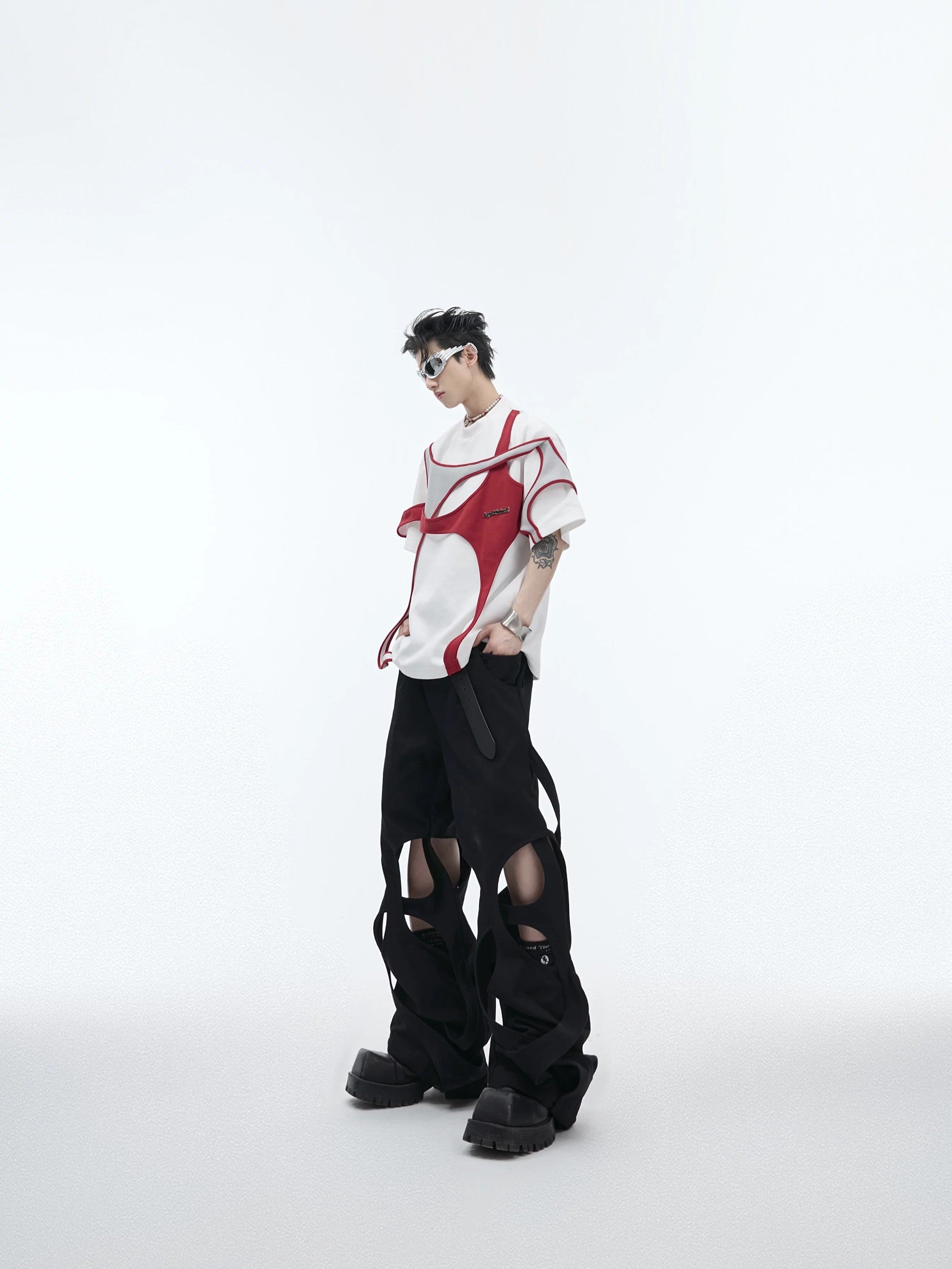 Detailed shot of titanium alloy studs and metal accents on the shirt