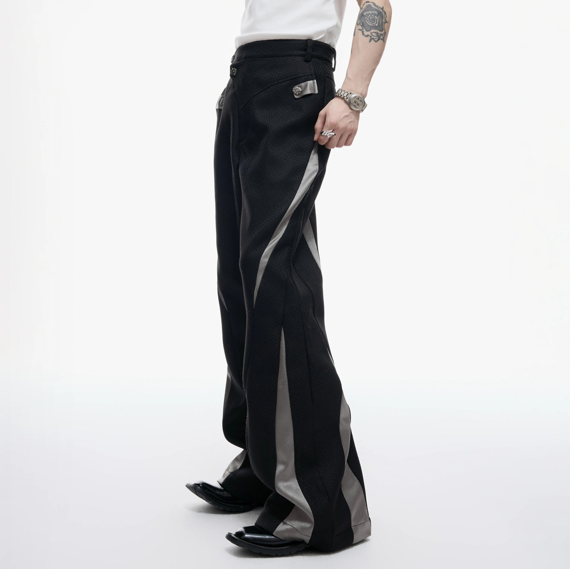 Model wearing the deconstructed set in an urban street setting