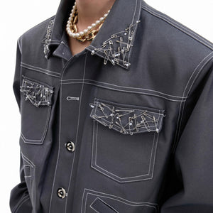 Close-up of handmade metal pins and pearl hardware on coated fabric