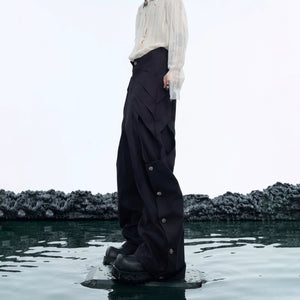 Model wearing black deconstructed cargo pants with chunky sneakers