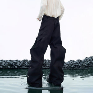 Detail shot of the asymmetric waist and premium fabric texture