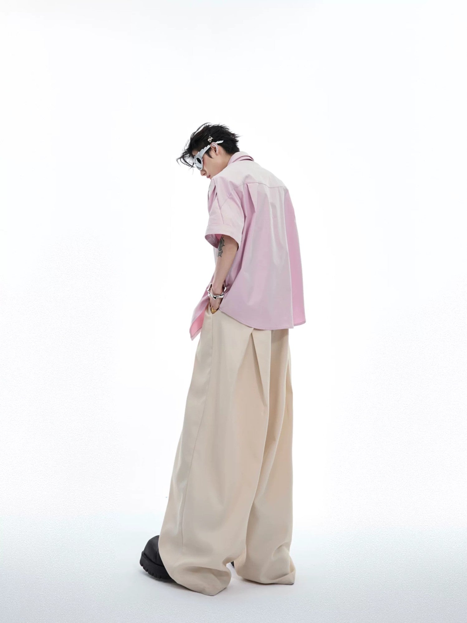 Back view of the oversized pink pleated shirt for men and women