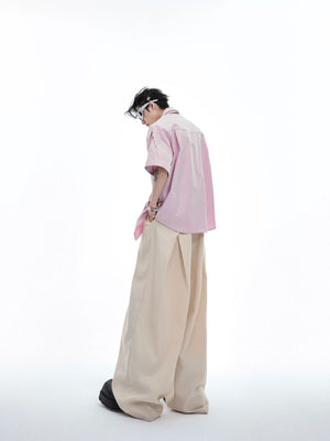 Back view of the oversized pink pleated shirt for men and women