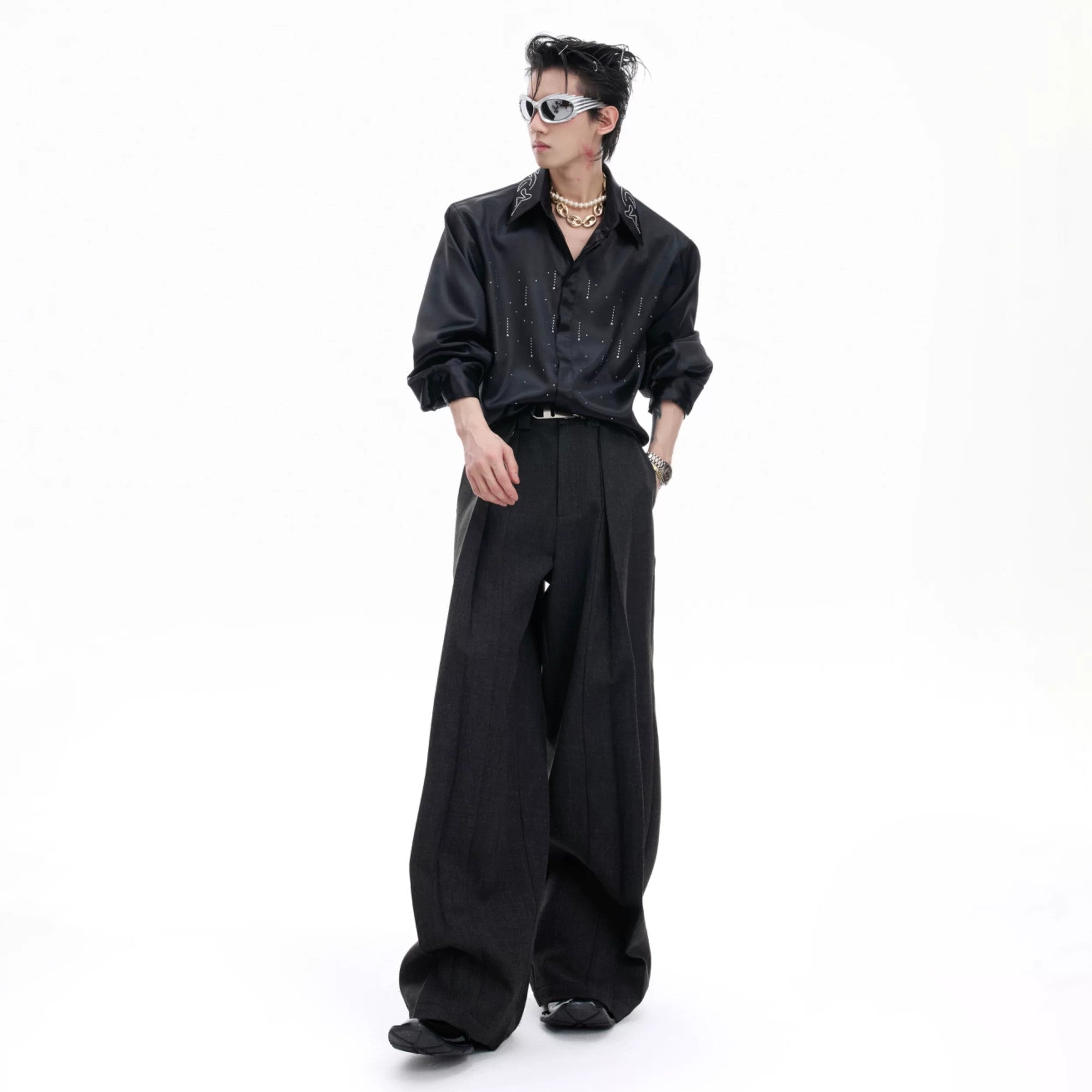 Model wearing deconstructed trousers with a streetwear aesthetic