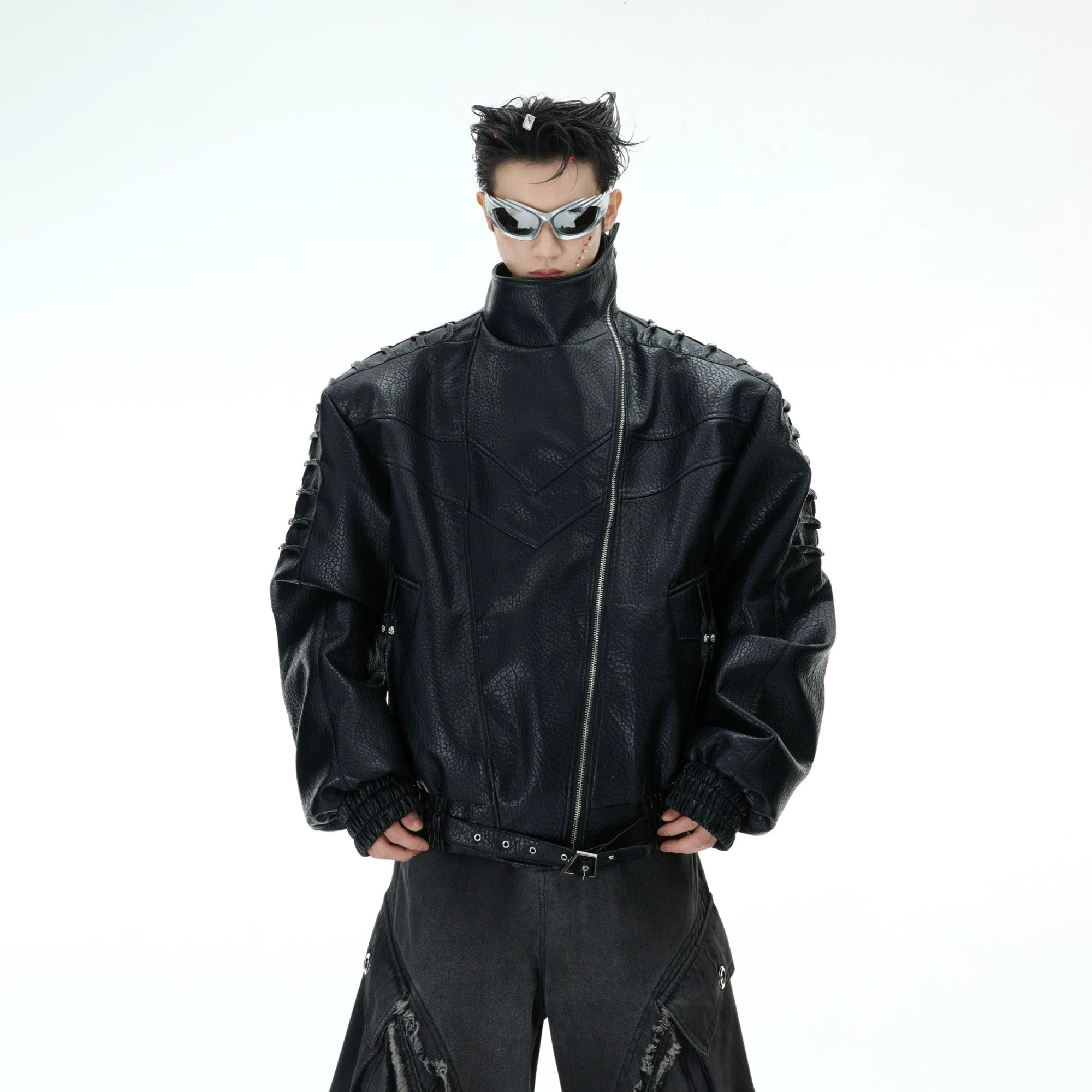 Back view showing unique spinal pleat design on a streetwear leather jacket