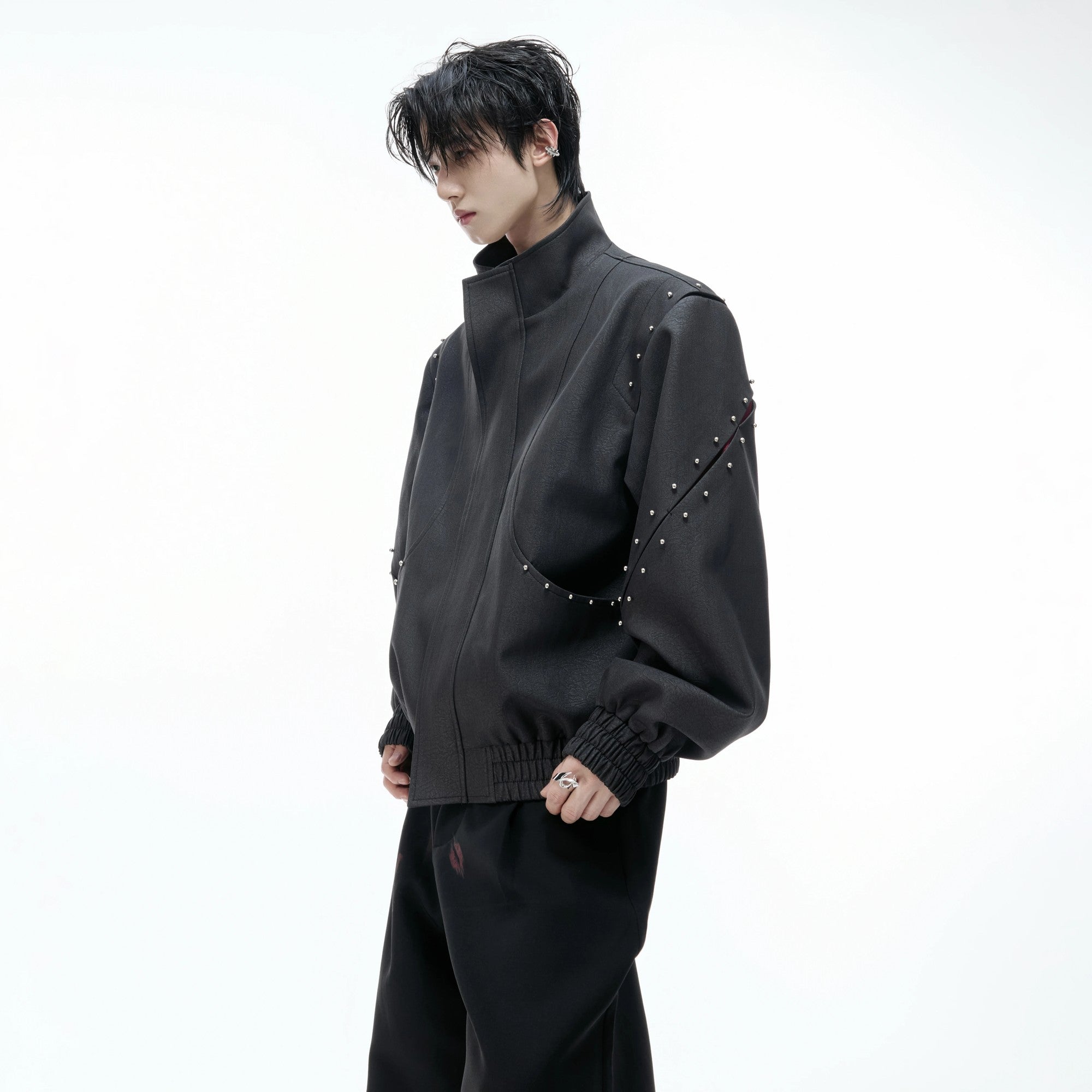 Back view showing signature hardware and loose fit