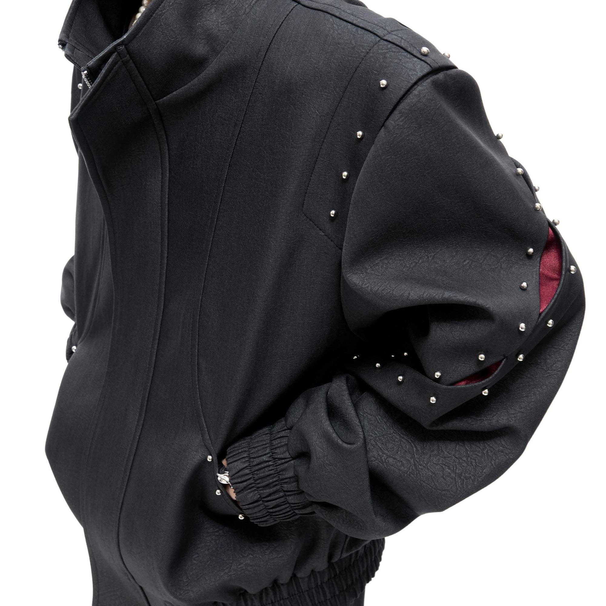 Close-up of matte alloy rivets and textured cotton fabric