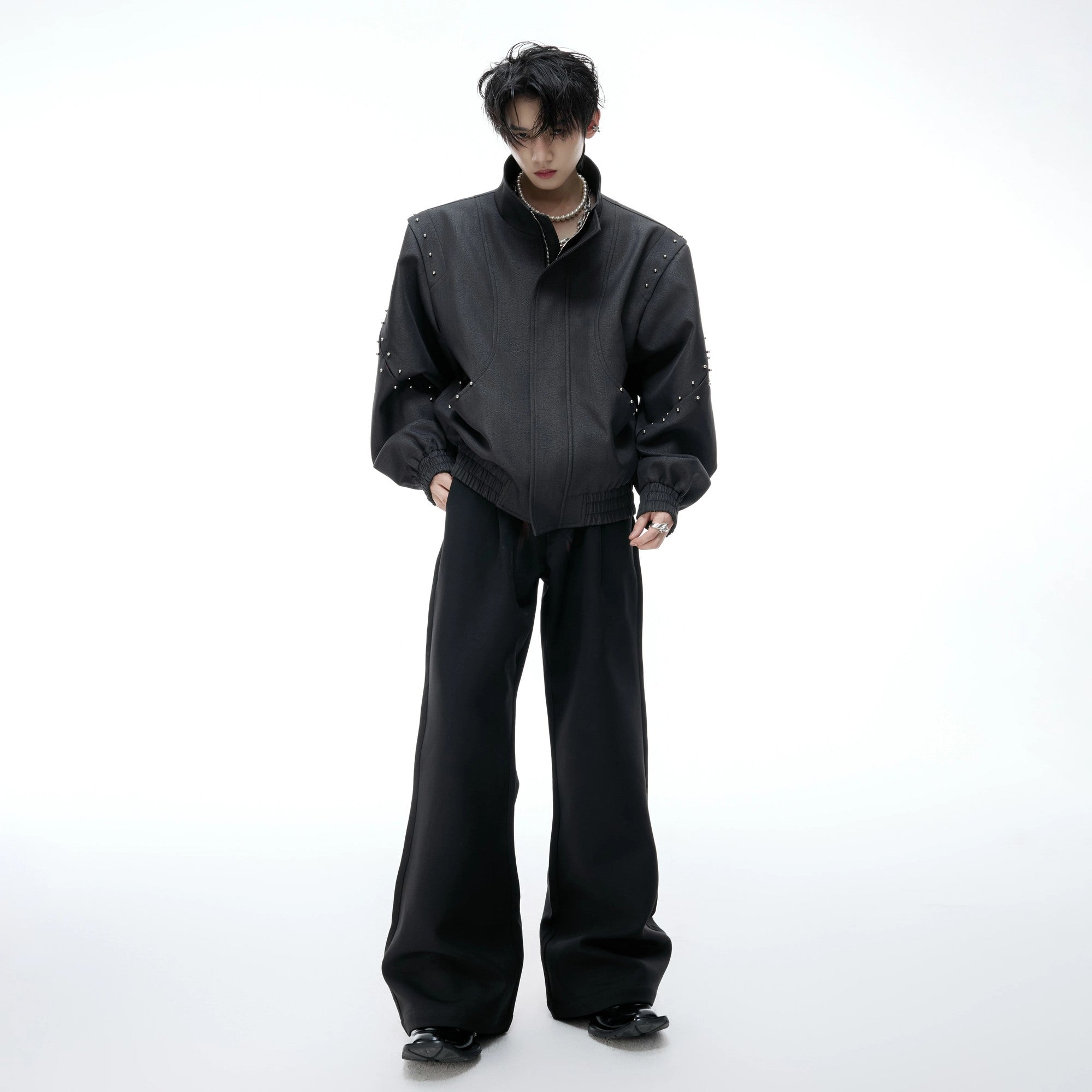 Detailed shot of elastic cuffed sleeves and hem design