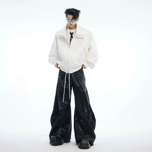 Model wearing white deconstructed shawl hoodie in street setting