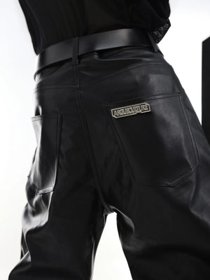 Back pocket view featuring a metal plate detail on punk style leather pants