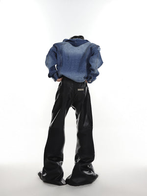 Street style model wearing deconstructed leather flare pants with boots