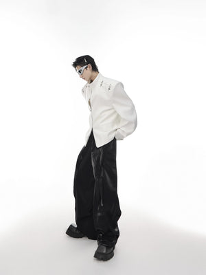 Man wearing white oversized deconstructed blazer in a street setting