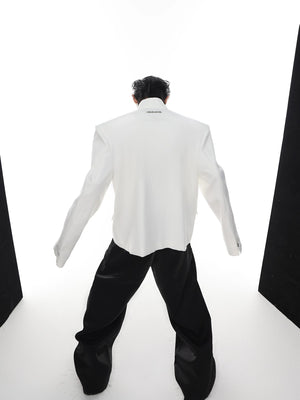 Detailed view of the stand collar and metal buckle styling on a blazer