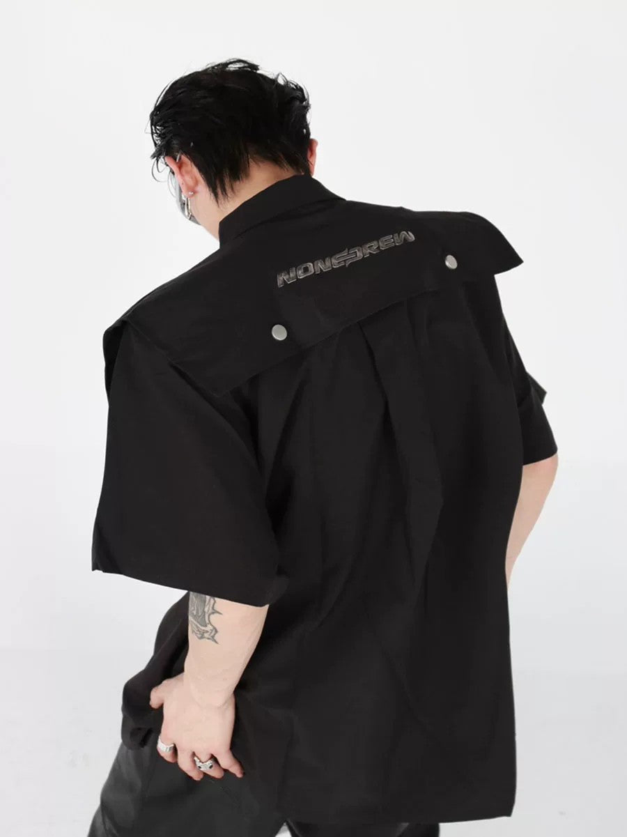 Close up of premium metal hardware on deconstructed streetwear top