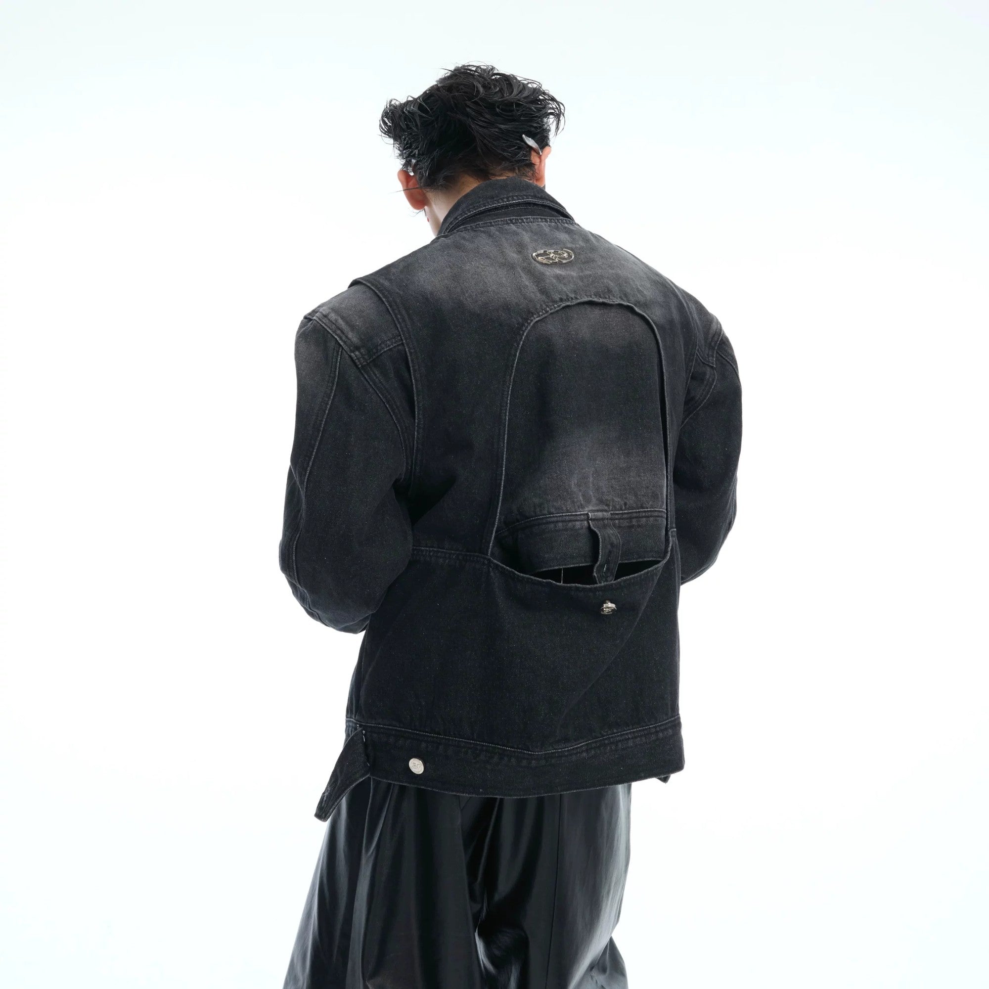 Close up of heavy denim fabric and deconstructed stitching details